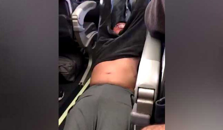 United Airlines staff drag passenger off flight