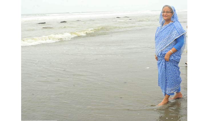 PM walks bare footed at sea beach