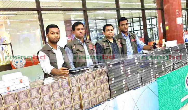 Mobile phone sets, cigarettes seized at Dhaka airport
