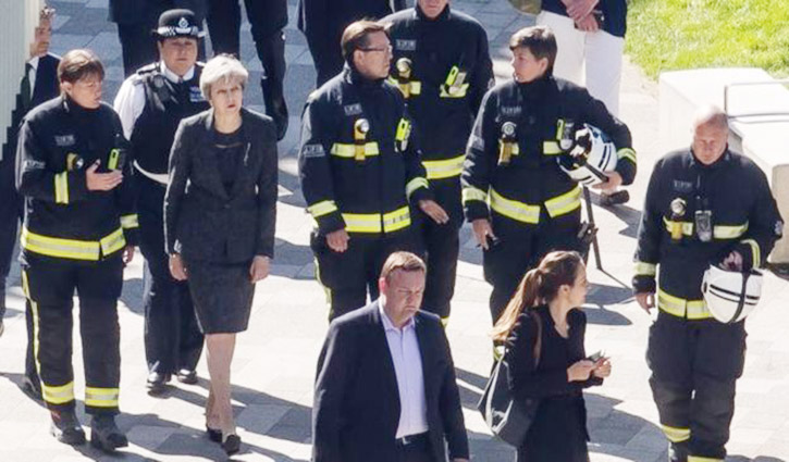 May announces public inquiry into Grenfell Tower fire