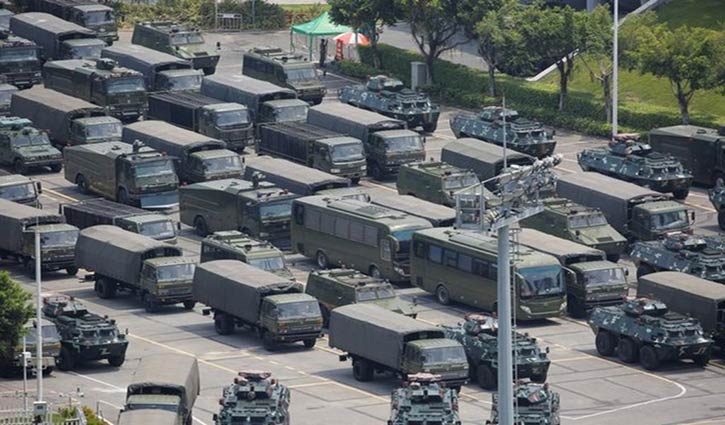 Chinese paramilitary forces gathered near Hong Kong border