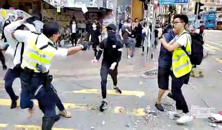 HK police shoot man rush hour protests