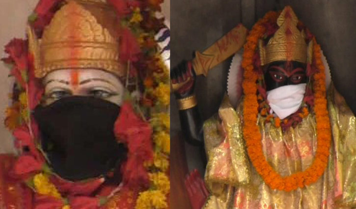 বায়ু দূষণের জেরে মূর্তির মুখেও মুখোশ বায়ু দূষণের জেরে মূর্তির মুখেও মুখোশ