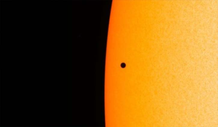 Planet Mercury passes across the face of the Sun