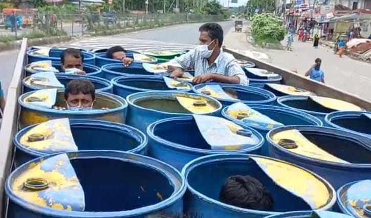 They were returning home hiding in fish drums on truck They were returning home hiding in fish drums on truck