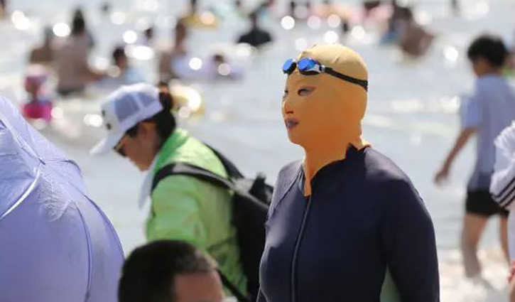 ‘Facekinis’ become popular in China as temperatures soar