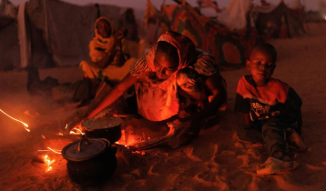 People eating grass, peanut shells in Sudan