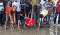 ফরিদপুর মেডিকেলের সামনে জমে থাকা পানিতে মাছ ছেড়ে প্রতিবাদ