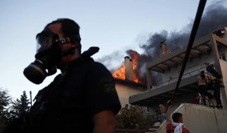 Greece battles wildfires, evacuating residents